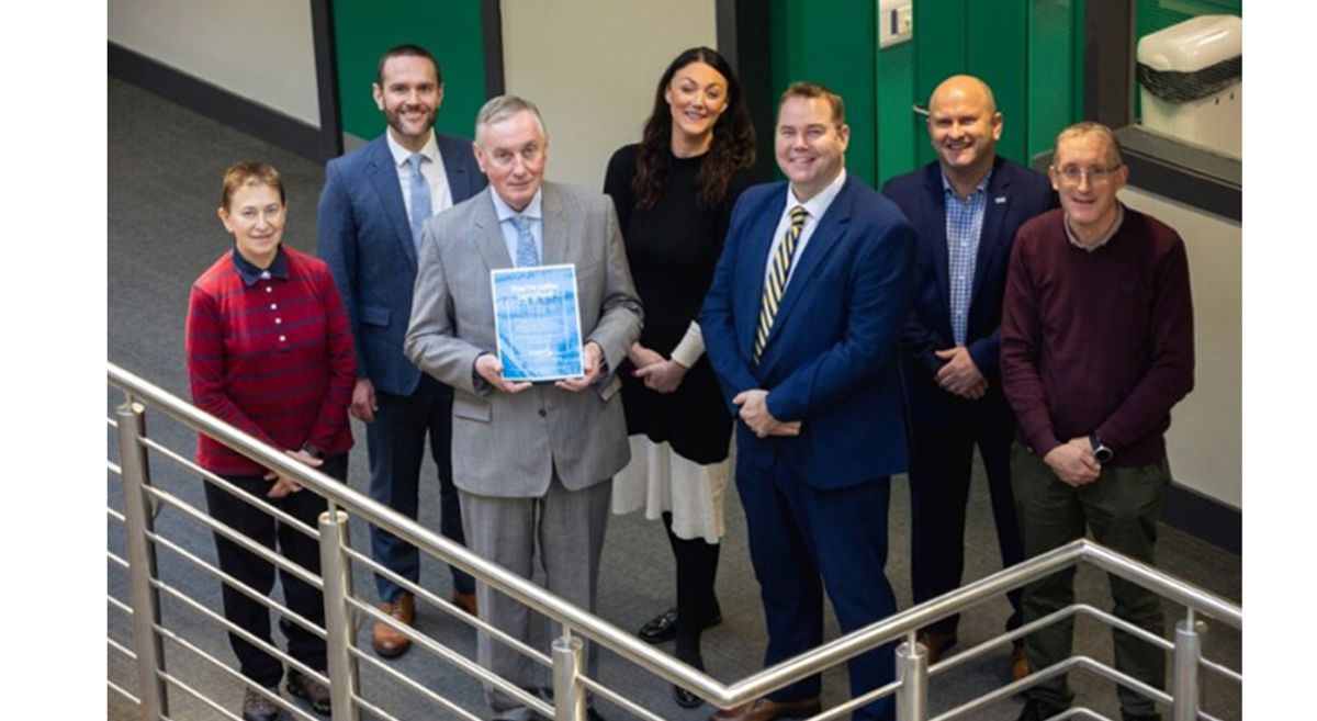 SERC Principal and Chief Executive Ken Webb holding a CompEx accreditation certificate, with SERC staff and guests from Forth Valley College, CompEx, the Department for the Economy and the Health and Safety Executive/